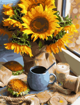 Букет подсолнухов и чашечка кофе